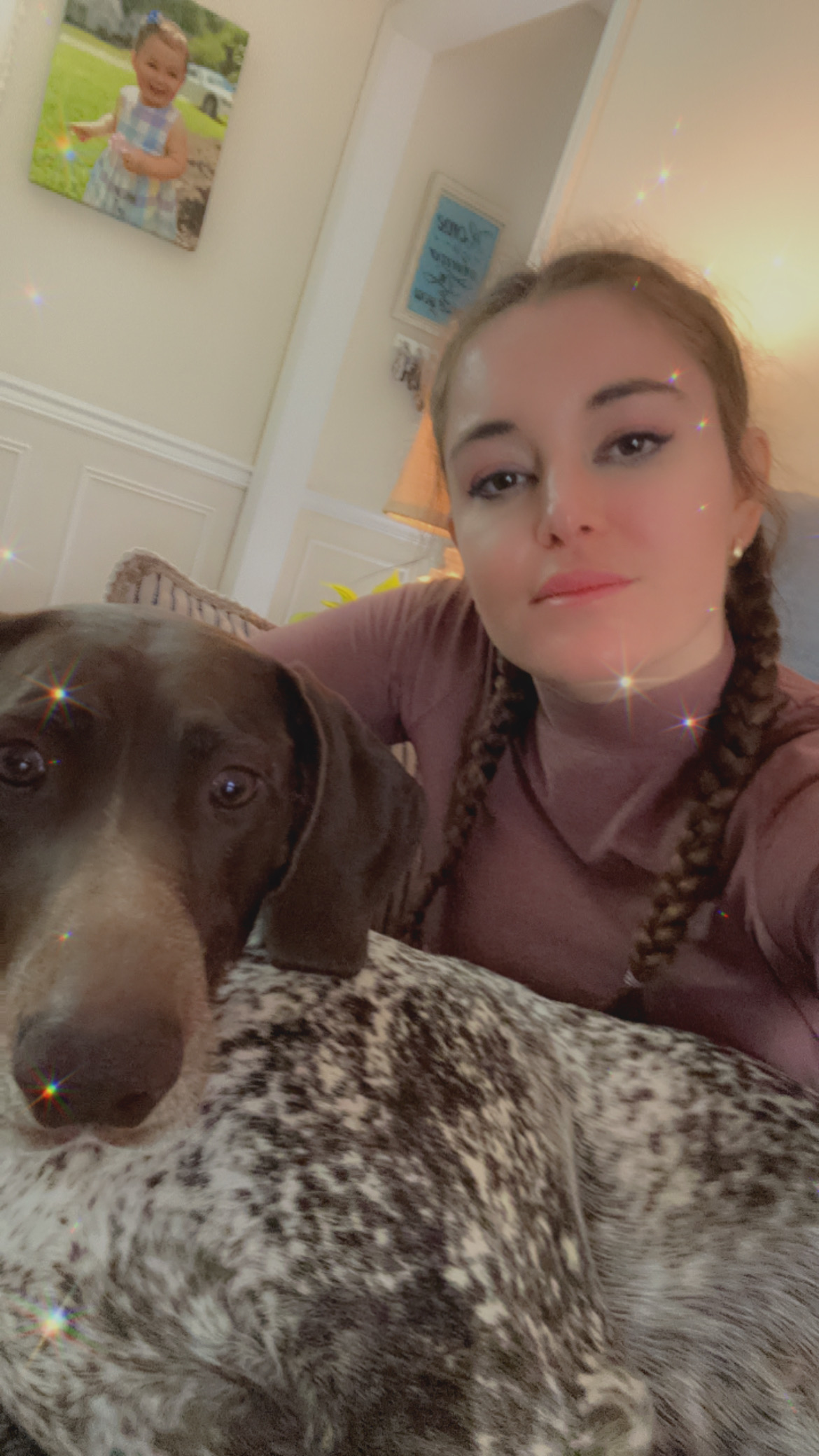 Alexis at home with a German shorthaired pointer